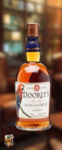 A bottle of Doorly&rsquo;s 5-year-old Barbados rum stands upright. The label, with a red and blue parrot and gold details, hints at a perfect mild cigars rum pairing against blurred brown-toned shelves and cozy lounge seating.
